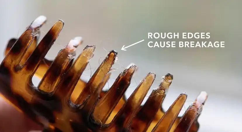 Close-up of damaged hair clip teeth showing rough edges that cause breakage